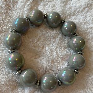 Garold Miller stretch bracelet with silver separators. Incandescent gray